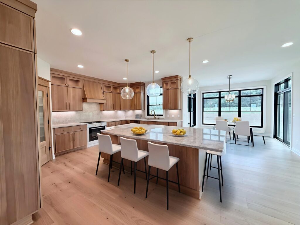 Stunning Open Concept Kitchen in White & Neutral Tones with Natural Wood & Marble Kitchen Island | Alliance Homes of Western New York