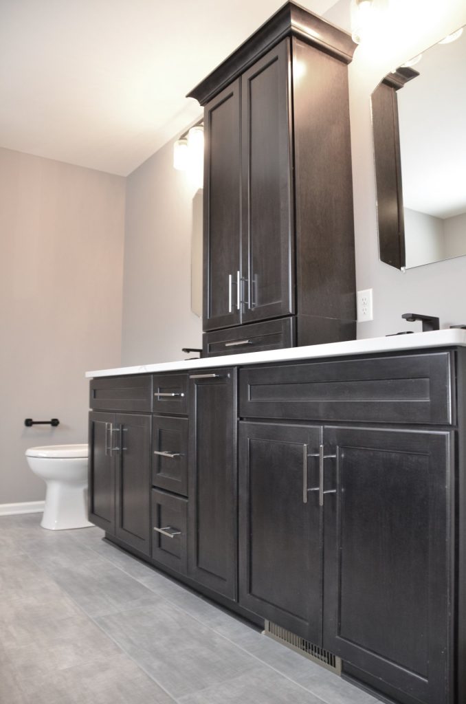 Bradford-Primary-Bath-Vanity-with-Dark-Cabinetry-White-Countertop-and-Tile-Flooring