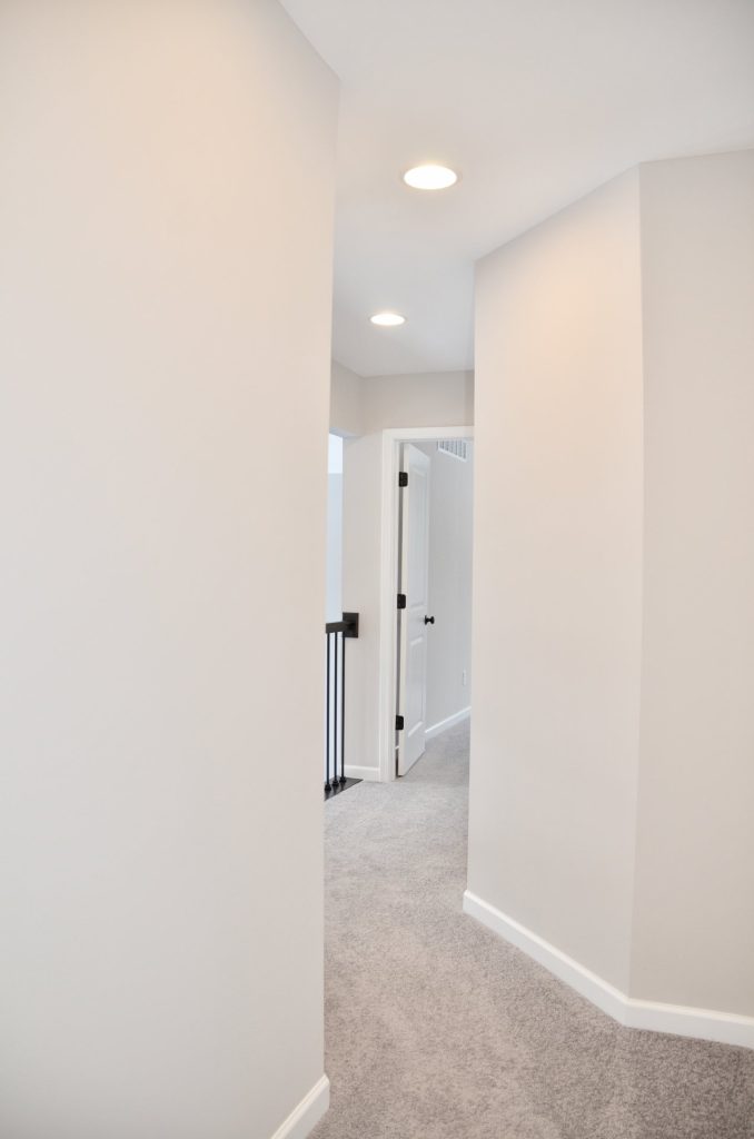 Bradford-Upper-Hall-with-Gray-Carpet-Soft-Neutral-Walls-and-Stair-Landing-View