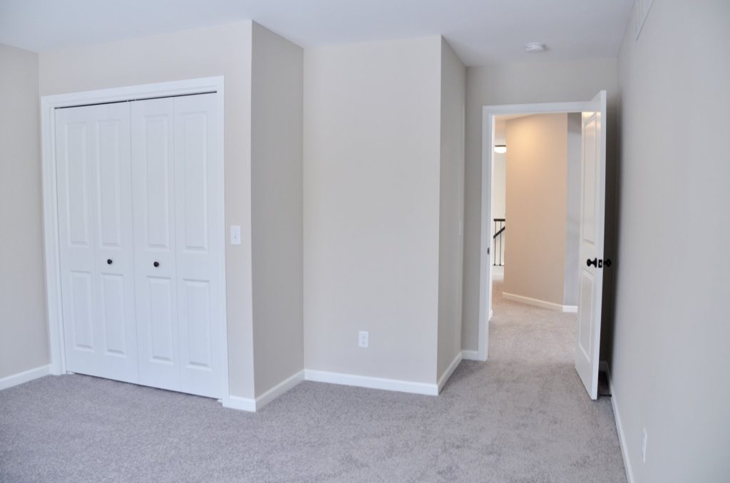 Bradford-Secondary-Bedroom-with-Gray-Carpet-Double-Door-Closet-and-Hall-Entry