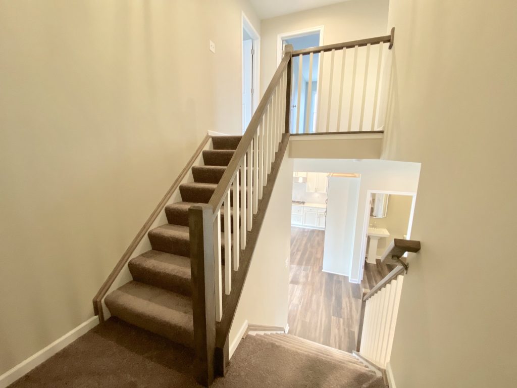 Concord-I-Upper-Stair-Landing-with-Carpet-White-Railings-and-View-to-First-Floor