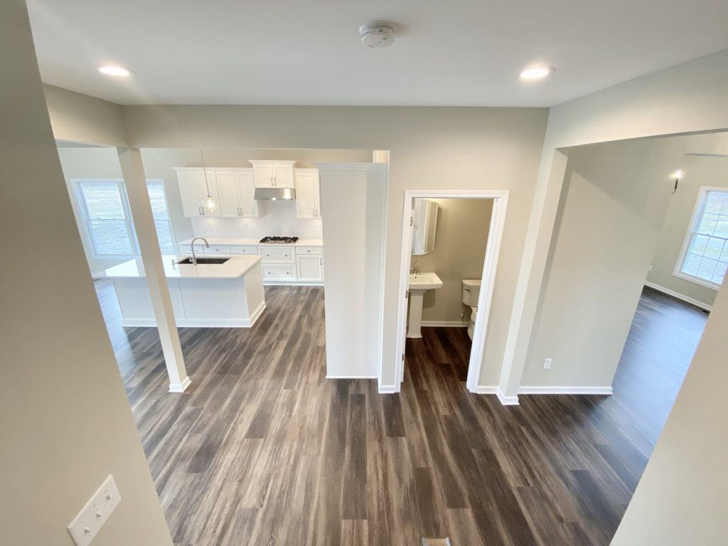 Concord-I-Upper-Landing-View-with-Open-Hallway-Powder-Room-Below-and-Kitchen-Sightline