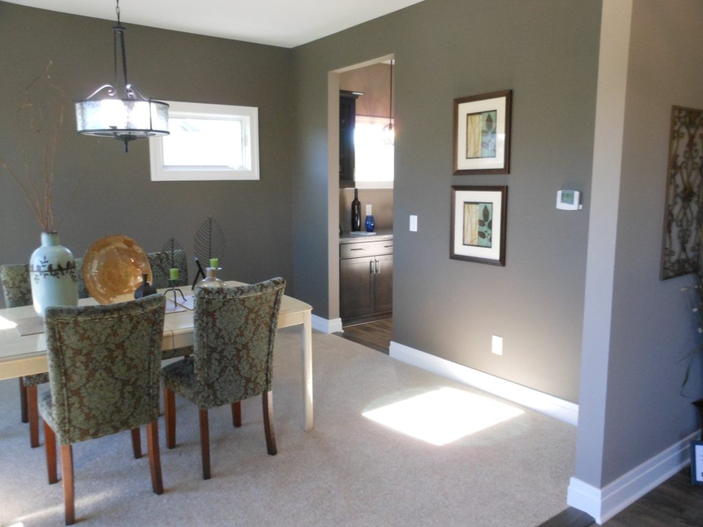 Dining Room with Taupe Walls, Carpet Flooring & Contemporary Pendant Light