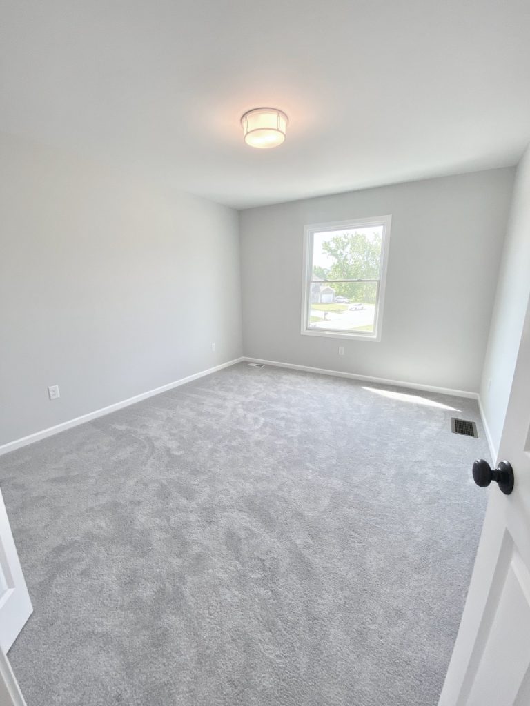 Forsythe Bedroom with Picture Window, Overhead Lighting and Light Gray Carpet