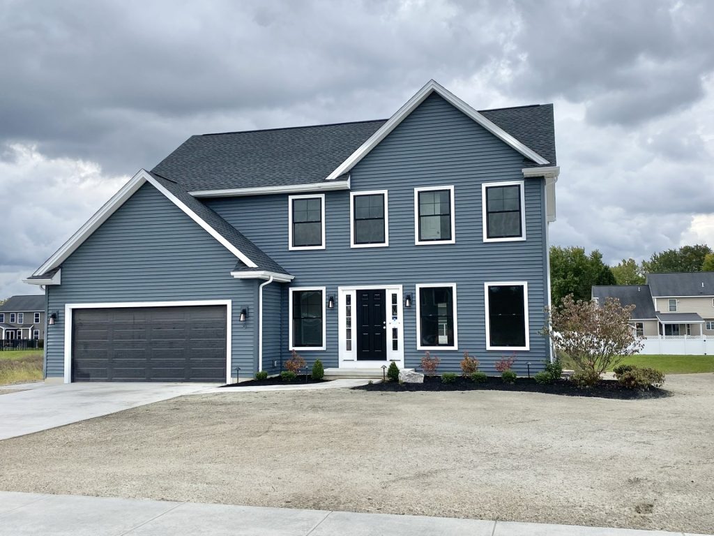 The Mackenzie 2-Story Home with Blue-Gray Siding, Black Front Door, White Trim & 2-Car Garage
