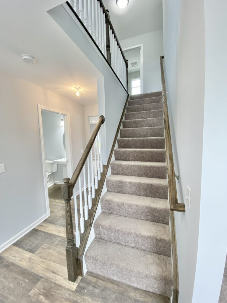 The Mackenzie Staircase with Carpeted Steps, White Balusters, Dark Handrail & Upper Landing