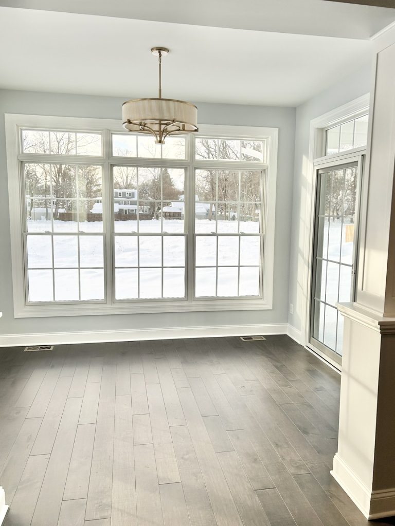 The Maple with Loft Dinette with Large Picture Window, Glass Door, Drum Chandelier & Wood-Look Flooring