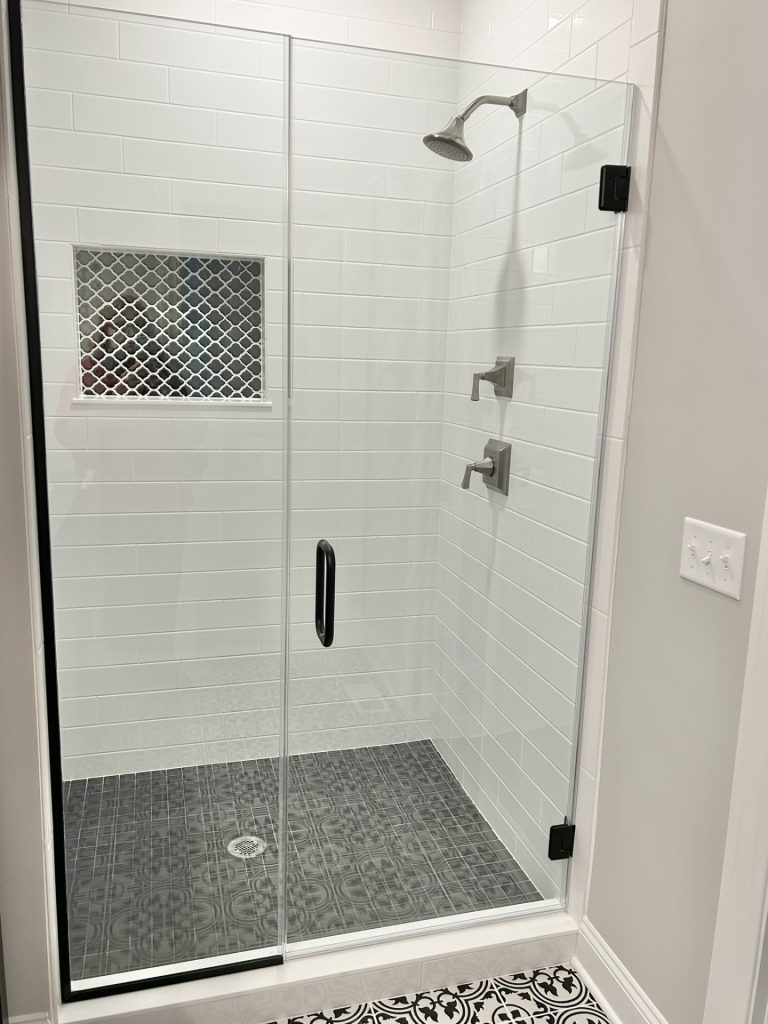 The Maple with Loft Walk-In Shower with Glass Door, White Tile Walls, Patterned Tile Floor & Mosaic Niche