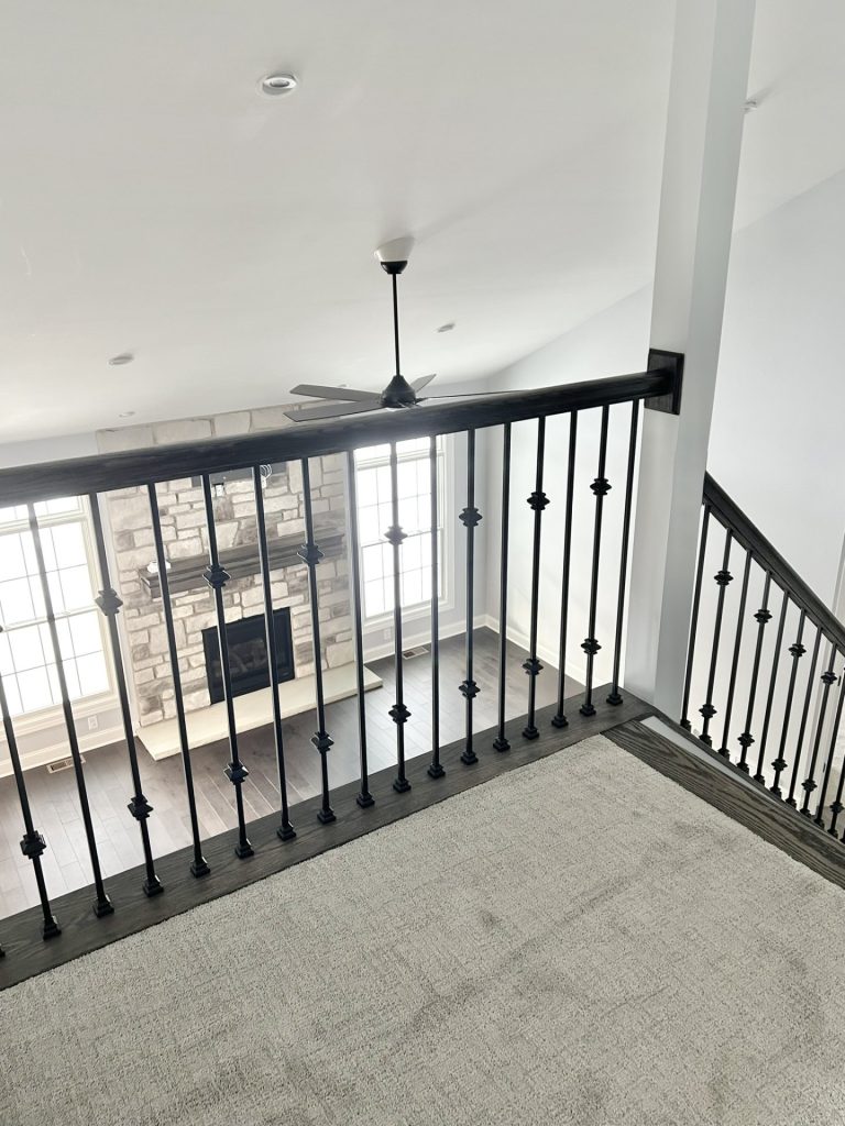 The Maple with Loft Loft Overlook with Black Balusters, Neutral Carpet, Fireplace View & High Ceiling