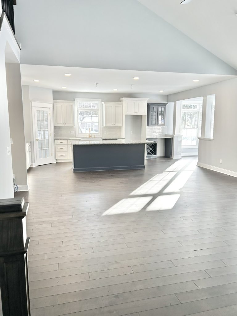 The Maple with Loft Open Great Room and Kitchen with Large Island, High Ceiling, Recessed Lighting, Multiple Windows & Wood-Look Flooring