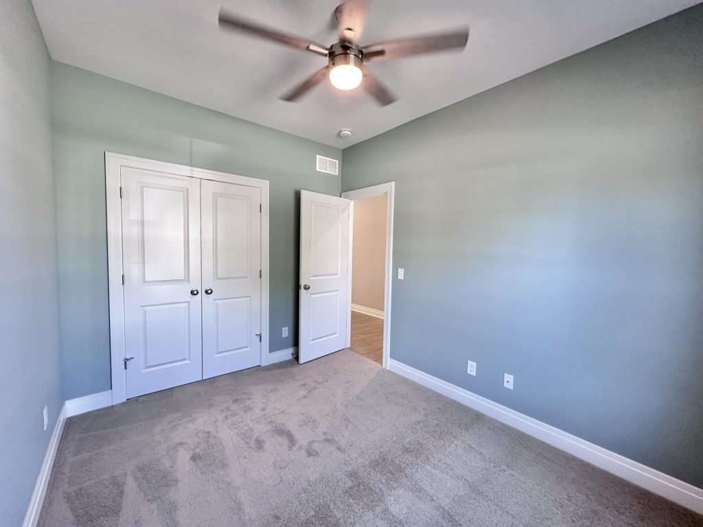 Bedroom-Teal-Green-and-Neutrals-with-Walk-in-Closet-Double-Door-Ceiling-Fan-Light-Fixture