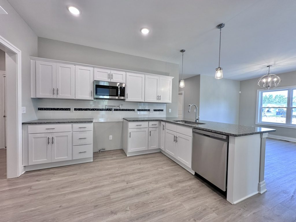 Pretty-Modern-Kitchen-in-White-Neutrals-with-Dark-Marble-Countertops