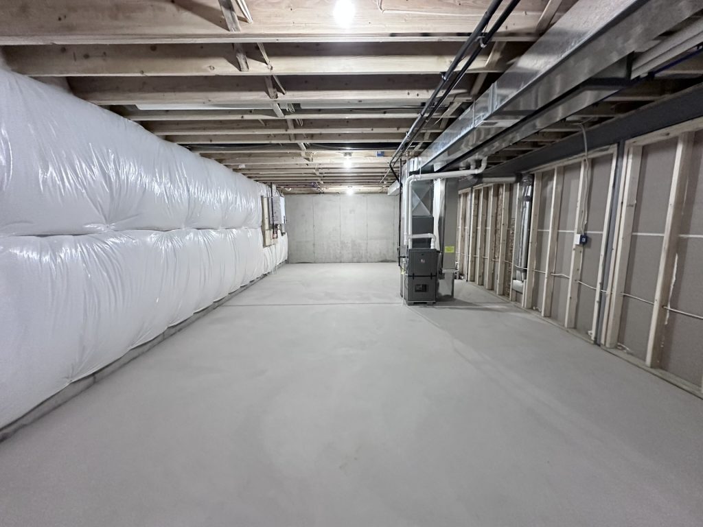 Madison-Full-Basement-with-Concrete-Floor-Exposed-Framing-and-Mechanical-Systems