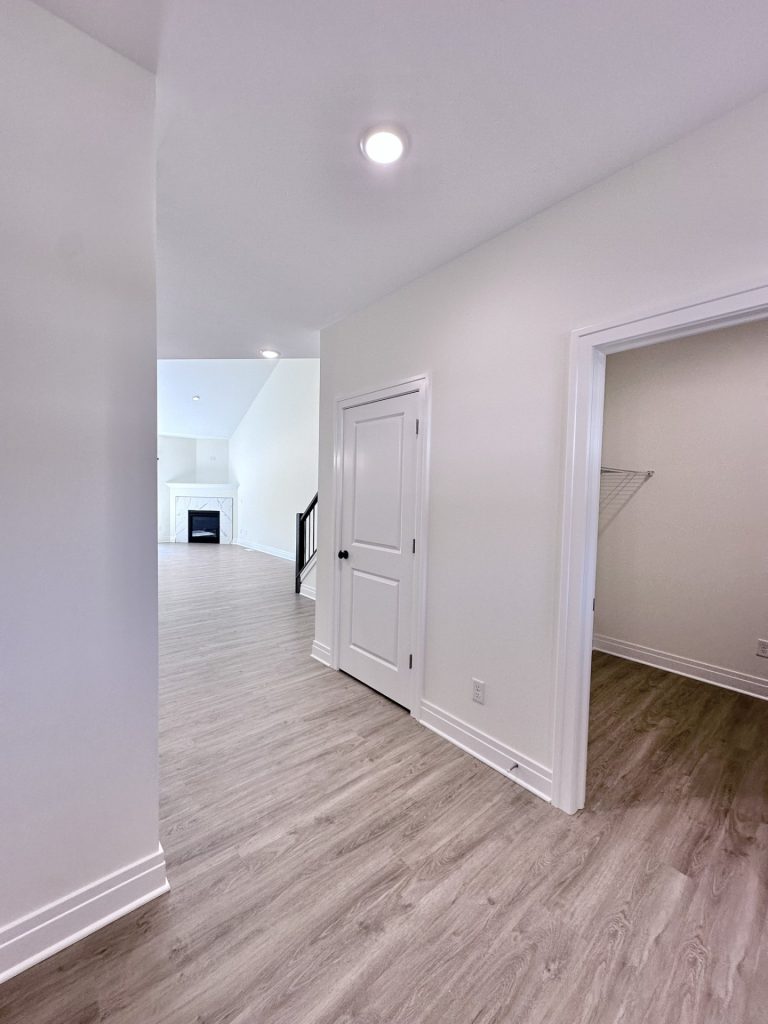 Madison-Main-Level-Transition-Space-with-Wood-Look-Flooring-and-Interior-Access