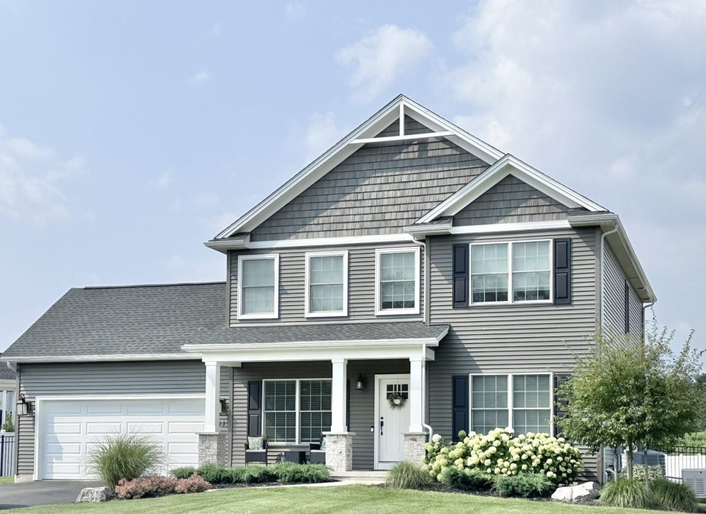 Concord-I-2-Story-Home-with-Gray-Siding-Dark-Shutters-Covered-Front-Porch-and-2-Car-Garage