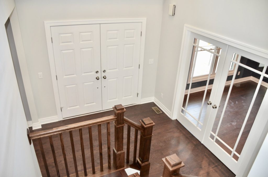 Arbordale-Front-Entry-Foyer-with-Double-Front-Doors-Dark-Wood-Flooring-and-Glass-French-Doors