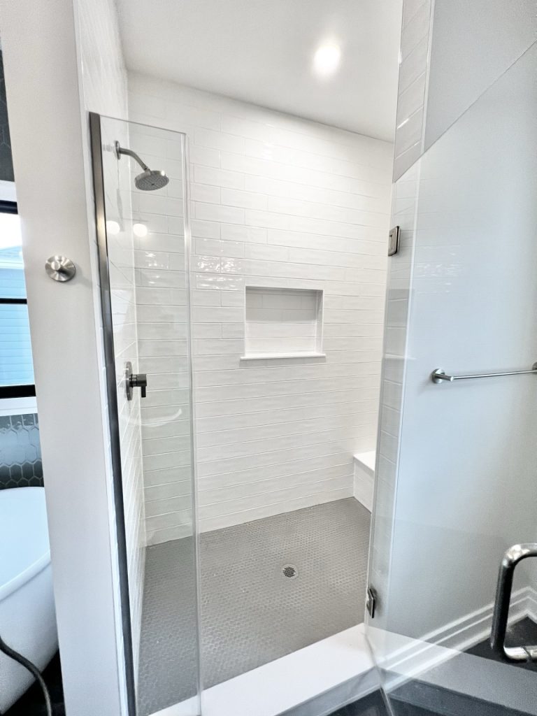 The Cedar Walk-In Shower with Glass Enclosure, White Tile Walls, Built-In Niche & Penny Tile Floor