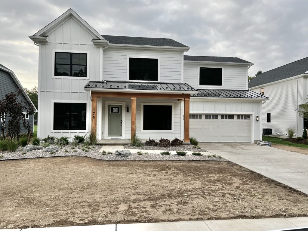 The Cedar: A New, 2-Story Home with White Board-and-Batten, Covered Front Porch, Black Windows & 2-Car Garage