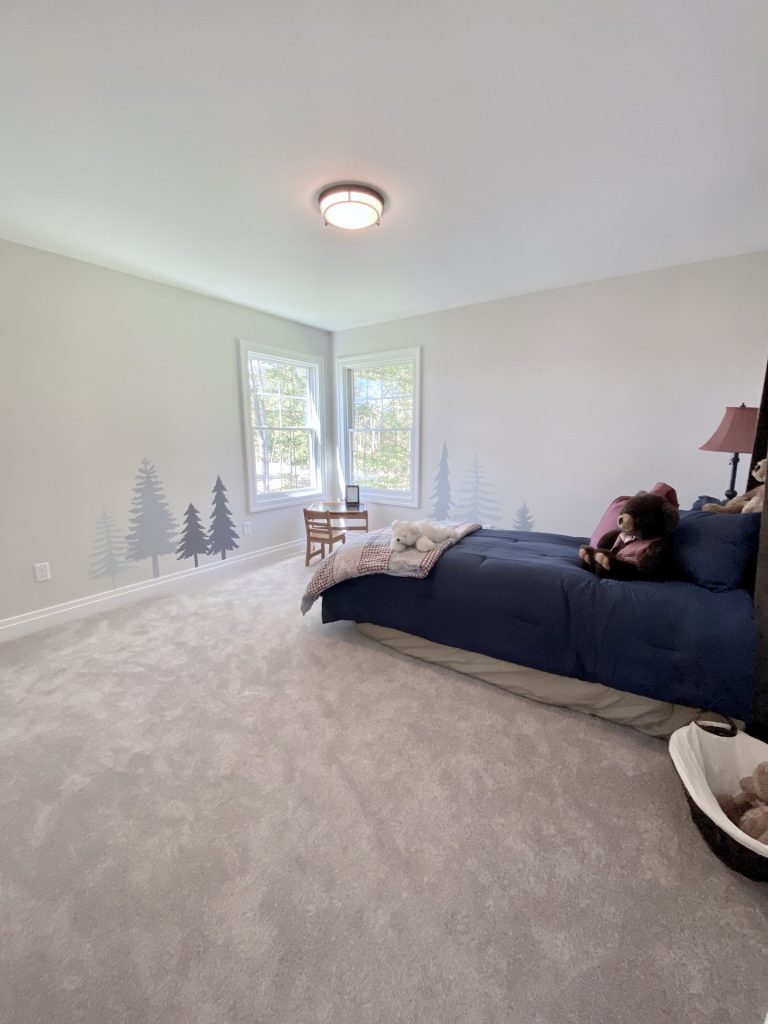 The Ruskin 2.0 Secondary Bedroom with Corner Windows, Neutral Carpet, Tree Wall Mural & Single Bed