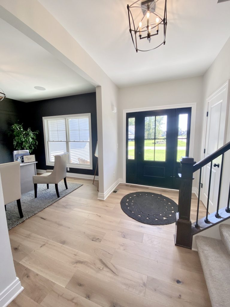 The Ruskin 2.0 Front Entry with Black Double Doors, Wood-Look Flooring, Staircase & Front Study View