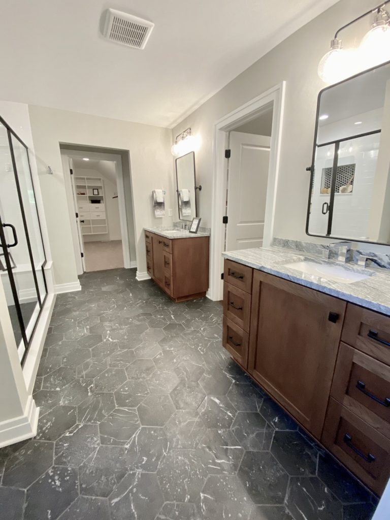 The Ruskin 2.0 Primary Bathroom with Dual Vanities, Dark Hex Tile, Glass Shower & Walk-In Closet View