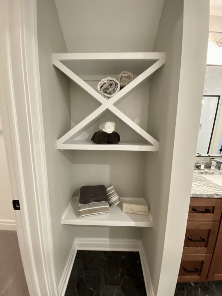The Ruskin 2.0 Built-In Linen Shelving with Crisscross Shelves, Open Storage & Dark Hex Tile Floor