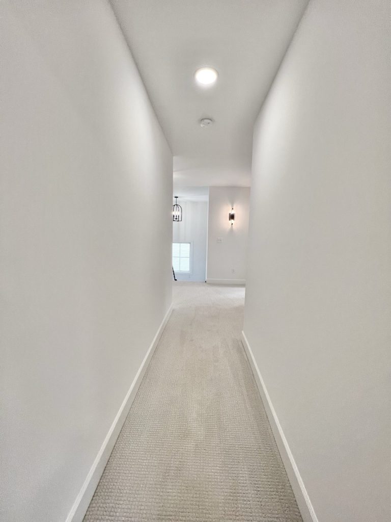 The Willow Upper Hallway with Neutral Carpet, Stair Opening, Bedroom Entries & Bathroom Entry