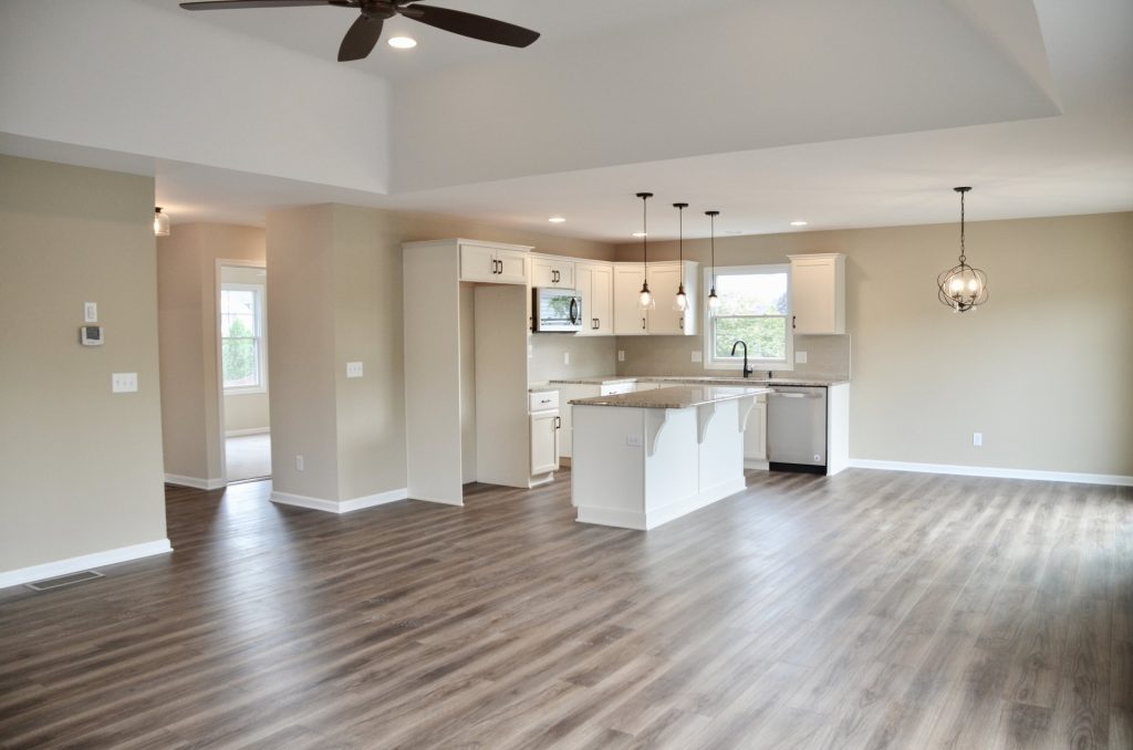 Baybrook-I-Open-Great-Room-Kitchen-and-Dinette-with-Tray-Ceiling-White-Cabinetry-and-Center-Island