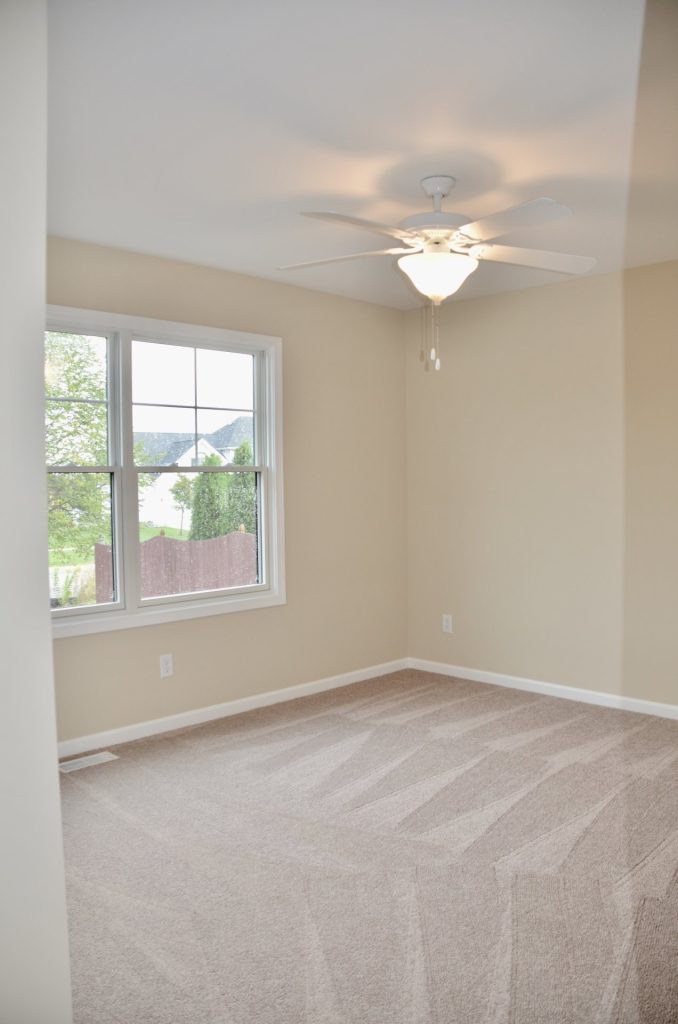 Baybrook-I-Secondary-Bedroom-with-Neutral-Carpet-Double-Window-and-White-Ceiling-Fan