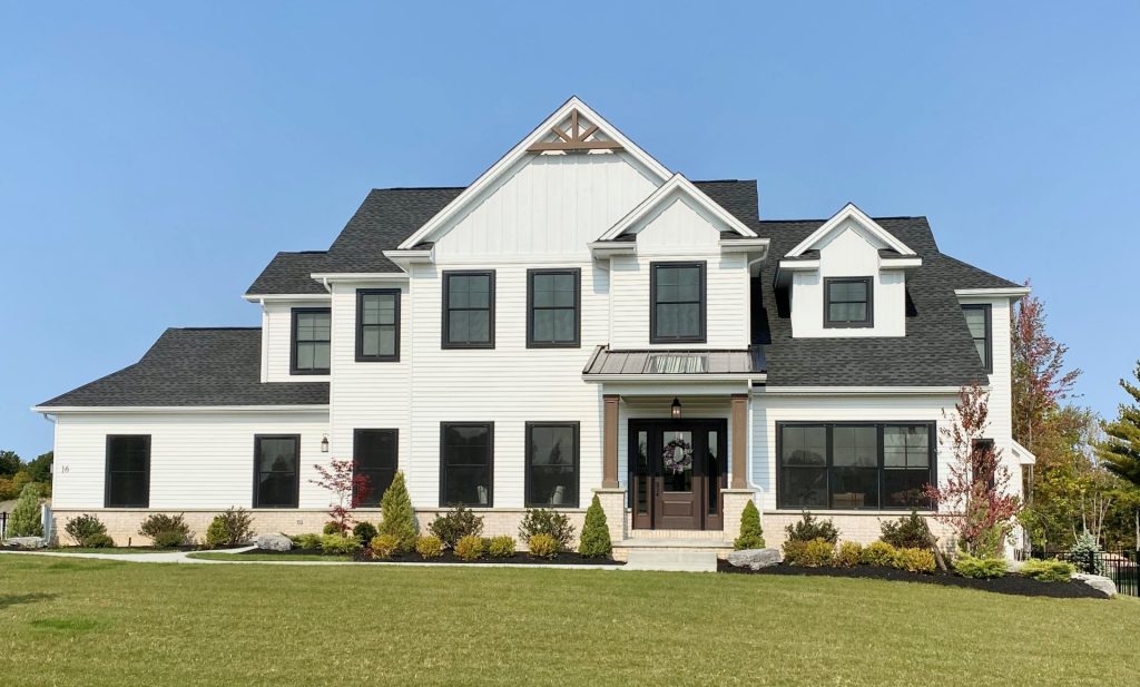The Stratford II Beautiful, 2-Story Home with Light Siding, Dark Windows, Covered Entry Porch & Attached Garage