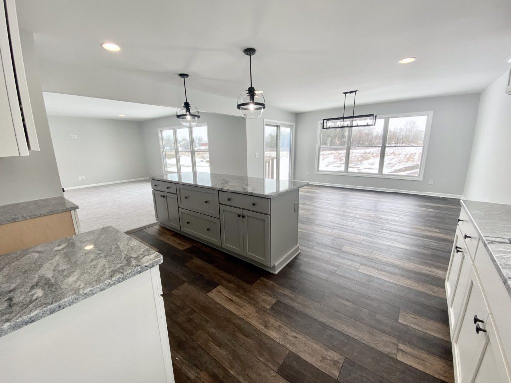 The Cooper I Kitchen with Gray Island, Large Windows, Wood-Look Flooring & Open Great Room