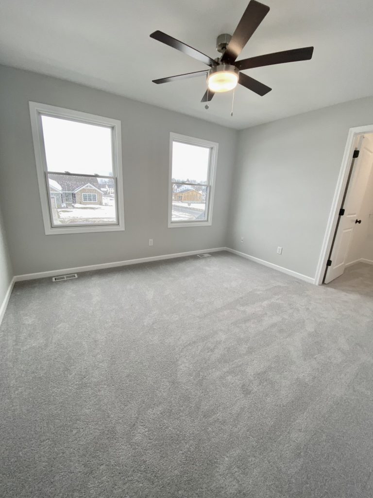 The Cooper I Secondary Bedroom with Light Carpet, Double Windows, Gray Walls & Ceiling Fan