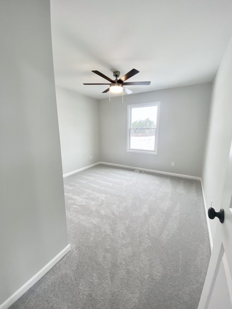 The Cooper I Secondary Bedroom with Light Carpet, Ceiling Fan, Light Walls & Single Window