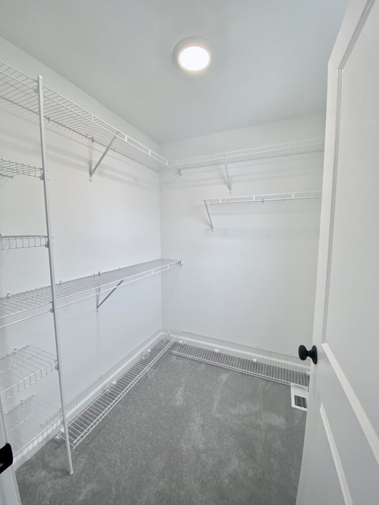 The Cooper I Walk-In Closet with Wire Shelving, Carpet Flooring & White Walls