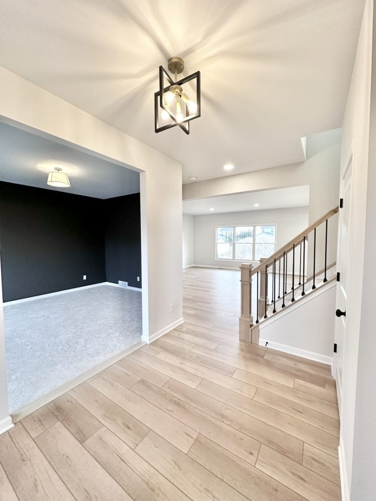 Cooper-Foyer-Entry-Wood-Look-Flooring-Open-Staircase-Front-Den