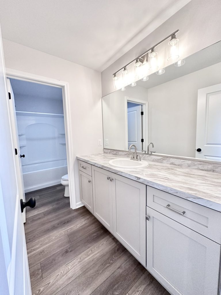 ooper-Full-Bath-Vanity-Long-Countertop-Large-Mirror-Linen-Storage-View