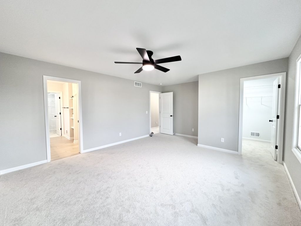 Cooper-Primary-Bedroom-Carpet-Black-Ceiling-Fan-Spacious-Layout