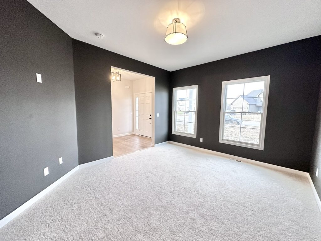 Cooper-Front-Den-Dark-Accent-Walls-Carpet-Double-Windows