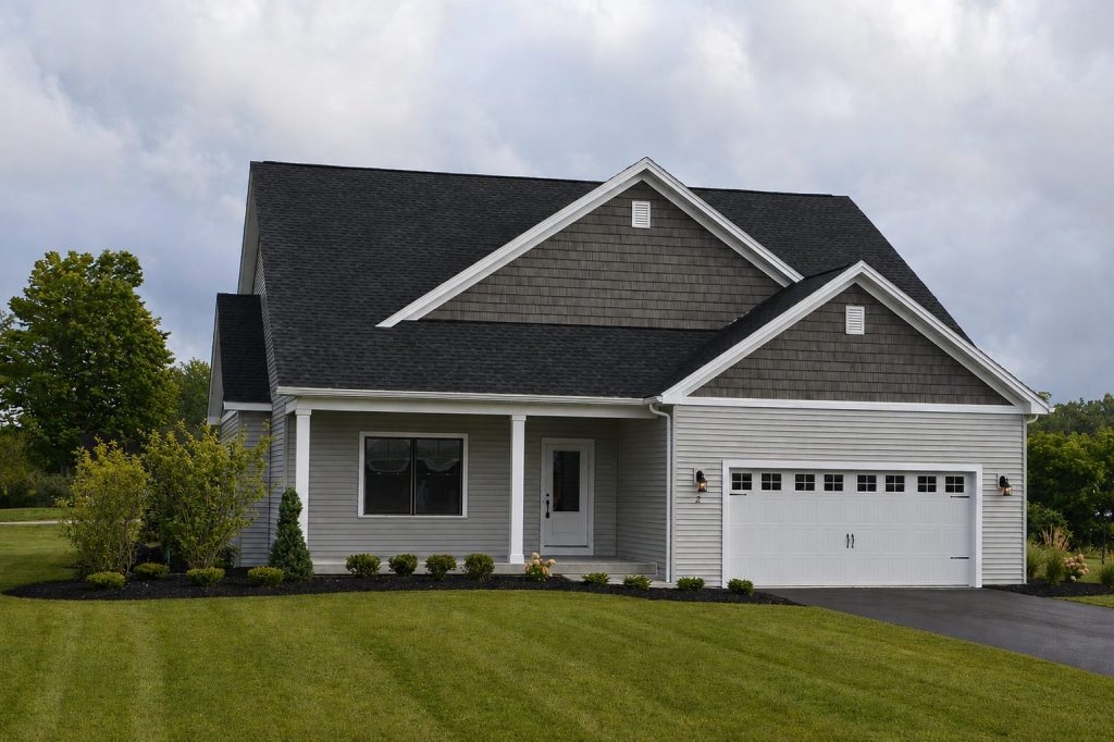 AI-generated marketing rendering of a gray two-story home exterior with a two-car garage